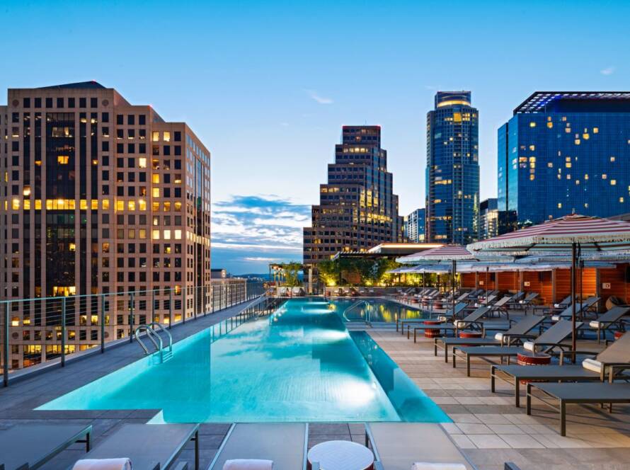 Rooftop pool at the Marriott Cesar Chavez in Austin with city skyline at dusk
