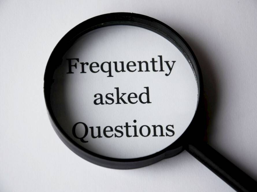 Magnifying glass over the words "Frequently asked Questions"