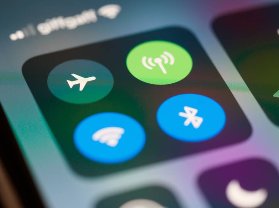 Close-up of smartphone control center icons for airplane mode, cellular, Wi-Fi and Bluetooth