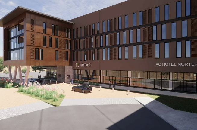 Rendering of a dual-brand Element and AC Hotel building with wood-toned facade and entry drive