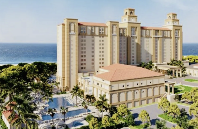 Rendering of a Mediterranean-style beachfront resort with bell towers, pools and palm trees
