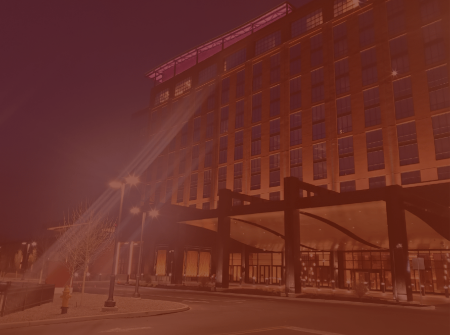 Wind Creek hotel exterior at night under a dark red color overlay