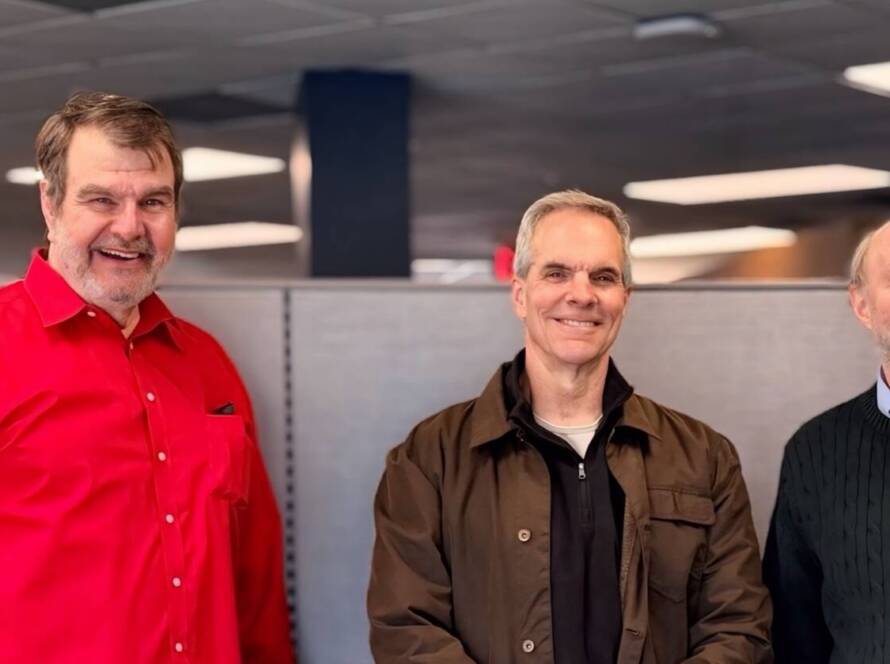 Five members of the NTI leadership team standing together in an office