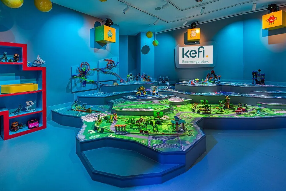 Kefi play space with a large illuminated toy train table