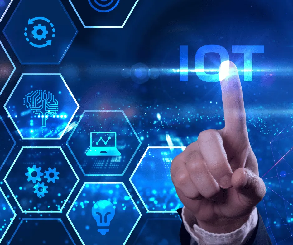 Finger touching a glowing IoT icon among hexagonal technology symbols
