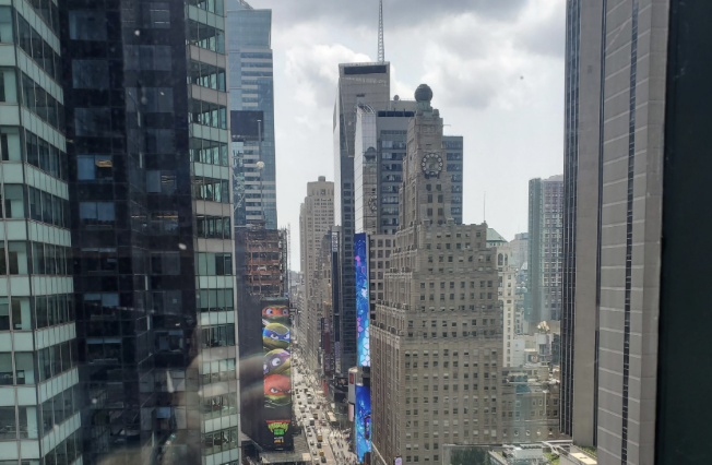 View of Times Square high-rises from an upper-floor window