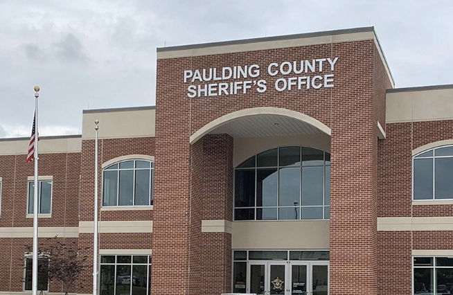 Paulding County Sheriff's Office brick building entrance with flagpoles