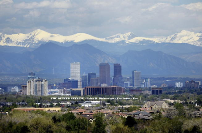 Denver skyline in front of snowcapped Rocky Mountains