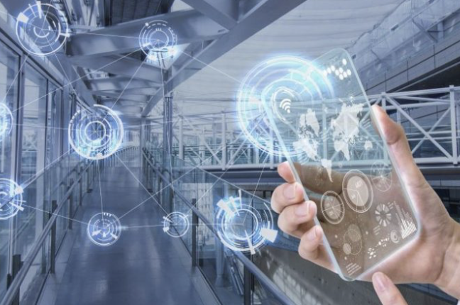 Hand holding a transparent smartphone with digital network icons over a modern walkway