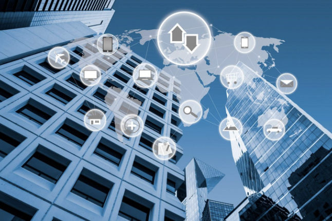 Office towers overlaid with a world map and connected device and network icons