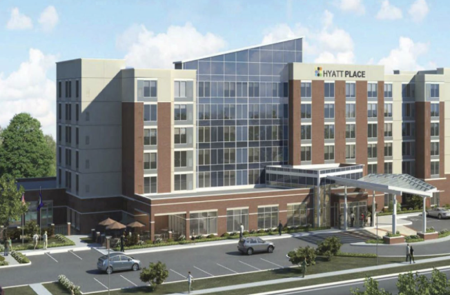 Rendering of a Hyatt Place hotel exterior with glass entrance canopy and parking lot