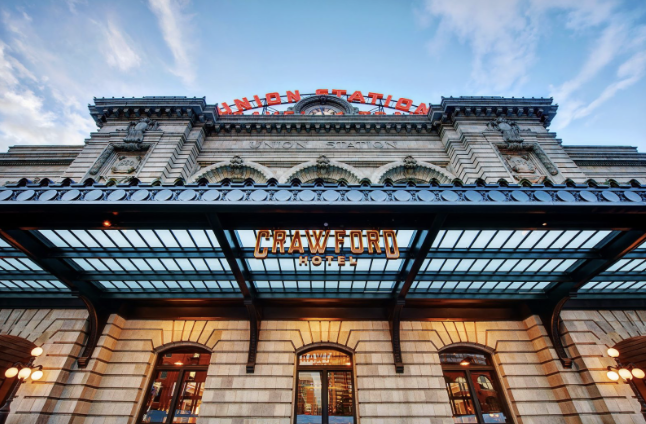 Denver Union Station facade with Crawford Hotel sign under the entrance canopy