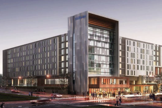 Rendering of a modern Hilton hotel with glass and metal facade at dusk