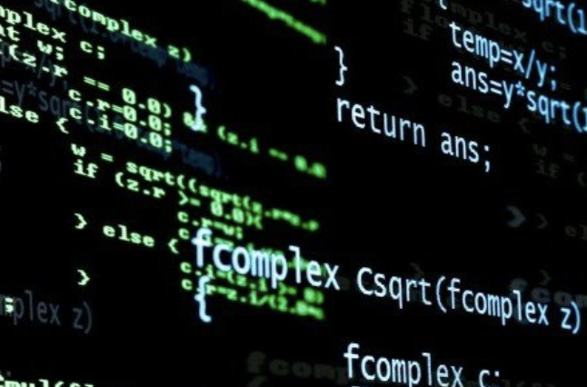 Close-up of green programming code on a black computer screen