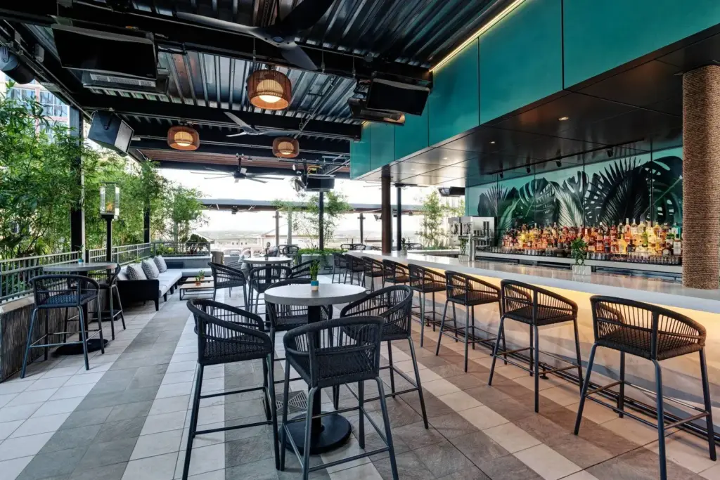 Zanzibar rooftop terrace bar with woven stools and lounge seating