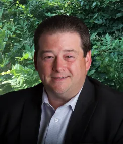Headshot of James Lingle in a dark blazer