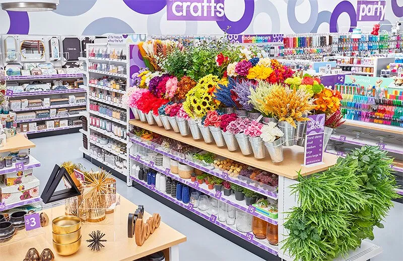 pOpshelf store interior with crafts, party supplies and artificial flowers