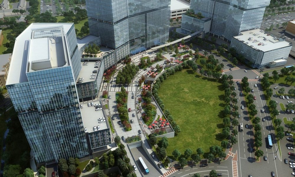 Rendering of State Farm's Park Center campus with glass towers around a green lawn