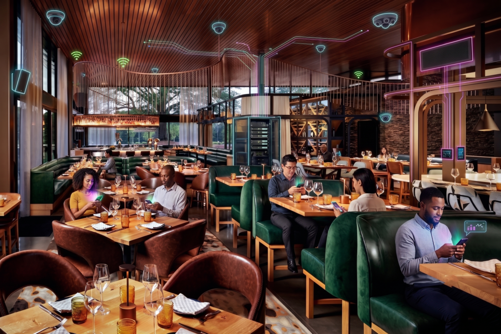 Restaurant at Hotel Hartness with diners and overlaid Wi-Fi and camera icons