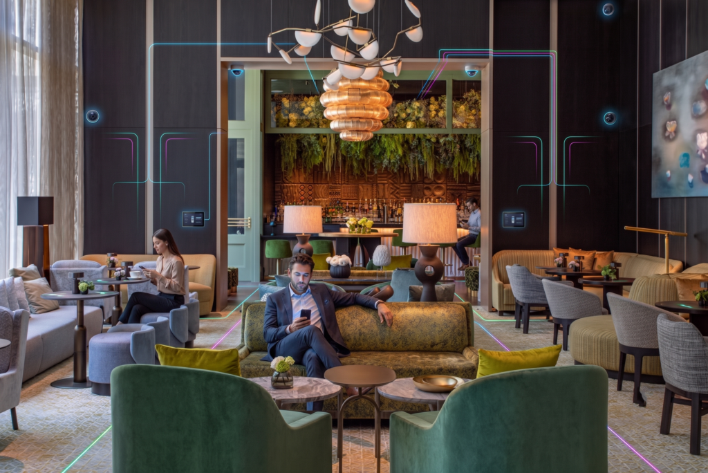 Lounge at the Ritz-Carlton New York with guests and overlaid network lines